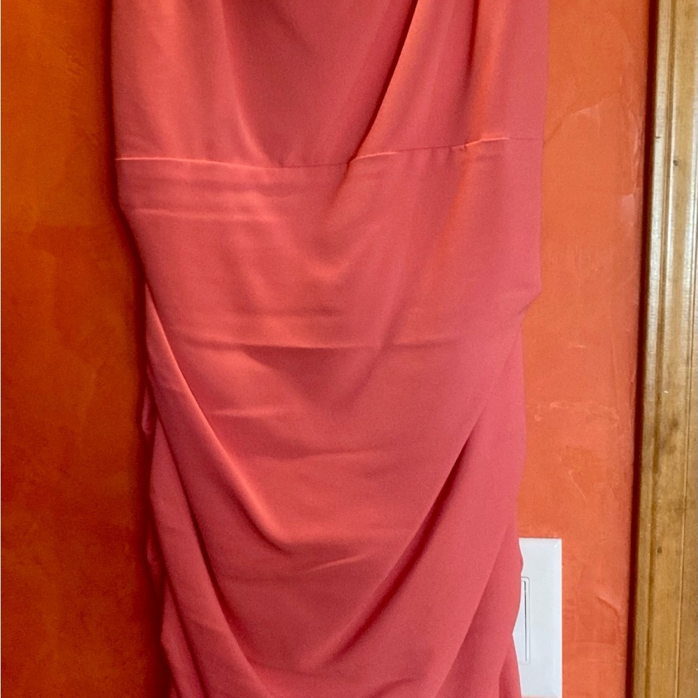 Peach sleeveless silk backless dress.